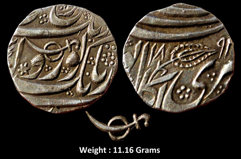 Independent Kingdom ; Sikh Empire ,
High Grade Silver Rupee ; Kashmir mint ;
Governor Mihan Singh Kumedan ; 1891 VS
Note : Silver rupee with a sword and shield symbol on the obverse and a leaf on the reverse. The sword and shield symbol represents Governor Mihan Singh,
Inscription: Gobindshahi couplet.
Weight : 11.16 Grams

Obv : (in Persian) Deg o tegh o fath o nusrat bedrang Yaft az Nanak Guru Gobind Singh Translation: Abundance, power and victory [and] assistance without delay are the gift of Nanak [and] Guru Gobind Singh.
Rev : (in Persian) Zarb Kashmir Sri Akal Pur Jib Translation: Struck in Kashmir, in the city of the timeless One.