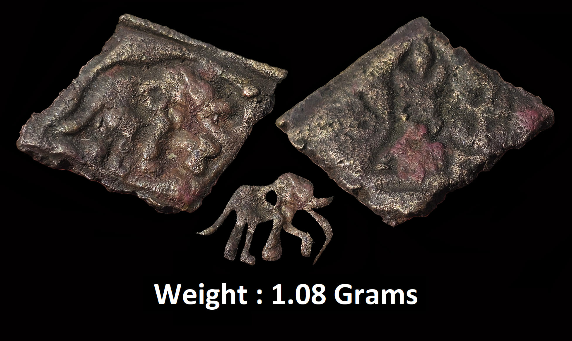 Ancient : Kaushambi Region ; Copper Unit 
Obv : Elephant walking towards right with trunk raised enclosed in a boundary 
Rev : Ujjaini Symbol with indra dwaja and 3 arch hill ;  Rare ; Weight : 1.08 Grams