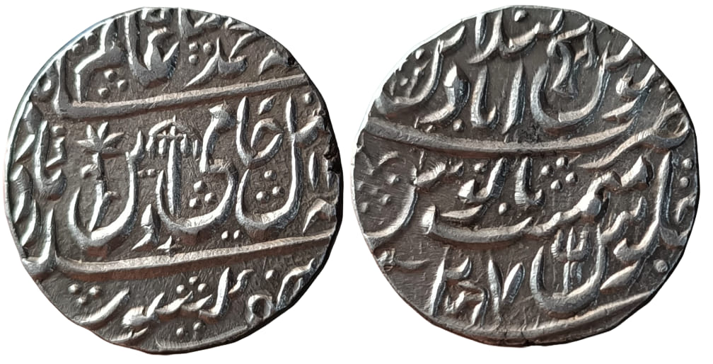 maratha-confideracy-mominabad-bindraban-full-mint-silver-rupee-ino-shah-alam-ii.jpg Maratha Confideracy ; Mominabad Bindraban ( Full Mint ) ; Silver Rupee ; INO Shah Alam II ; RY 27;With additional " " Symbol between RY.