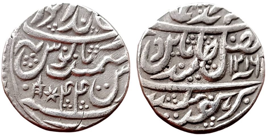 bharatpur-ranjit-singh-silver-rupee-brajendrapur-mint-ino-shah-alam-ii-ah-1216-ry-44-broad-flan-very-scarce-note-katar-and-star-mint-mark-on-reverse.jpg Bharatpur, Ranjit Singh ; Silver rupee, Brajendrapur mint, INO Shah Alam II, AH 1216 /RY 44, Broad flan, Very Scarce Note : Katar and Star mint-mark on reverse