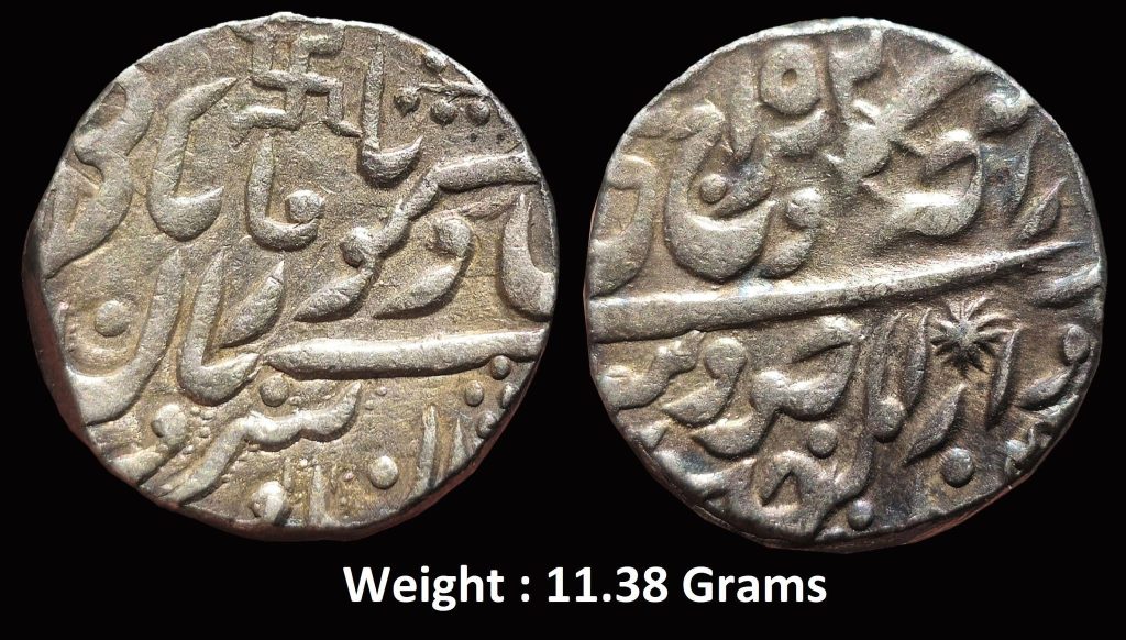 Princely State ; Jodhpur ; Silver Rupee ; Issued in the name of Maharaja Takht Singh & Queen Victoria ; Mint : Dar al-Mansur Jodhpur (pseudo) - Pali ; Mintmark : Swastika, Jhar + Sword